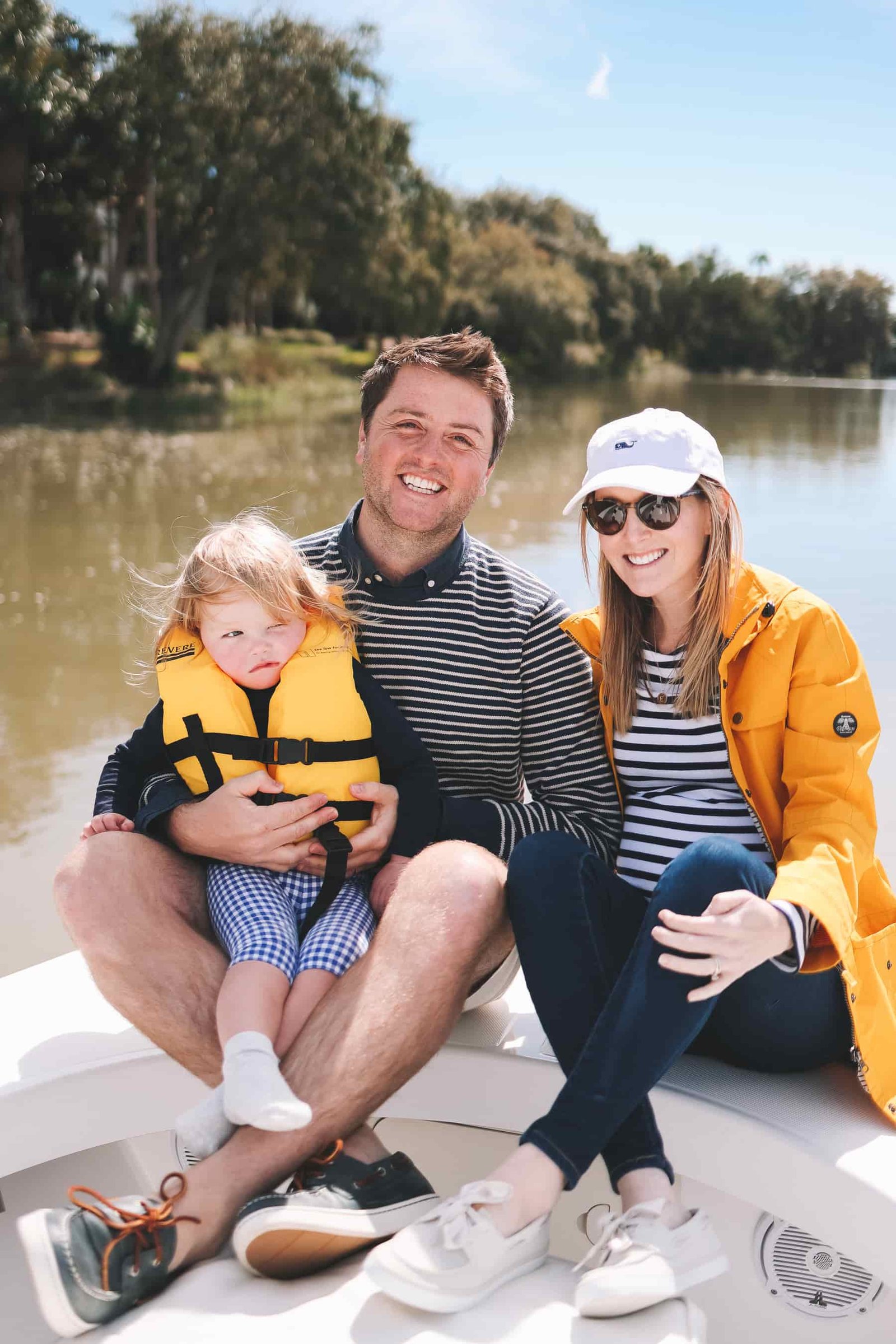 Outfit details: Kelly's Sperry Sailor Boat Shoes c/o, Striped T-Shirt (Maternity here), Yellow Raincoat (Similar here), White Hat, and Skinny Jeans (Maternity version here.) / Mitch's Sperry Cup Modern Boat Shoes c/o, Striped Crewneck Sweater, Poplin Shirt, Breaker Shorts