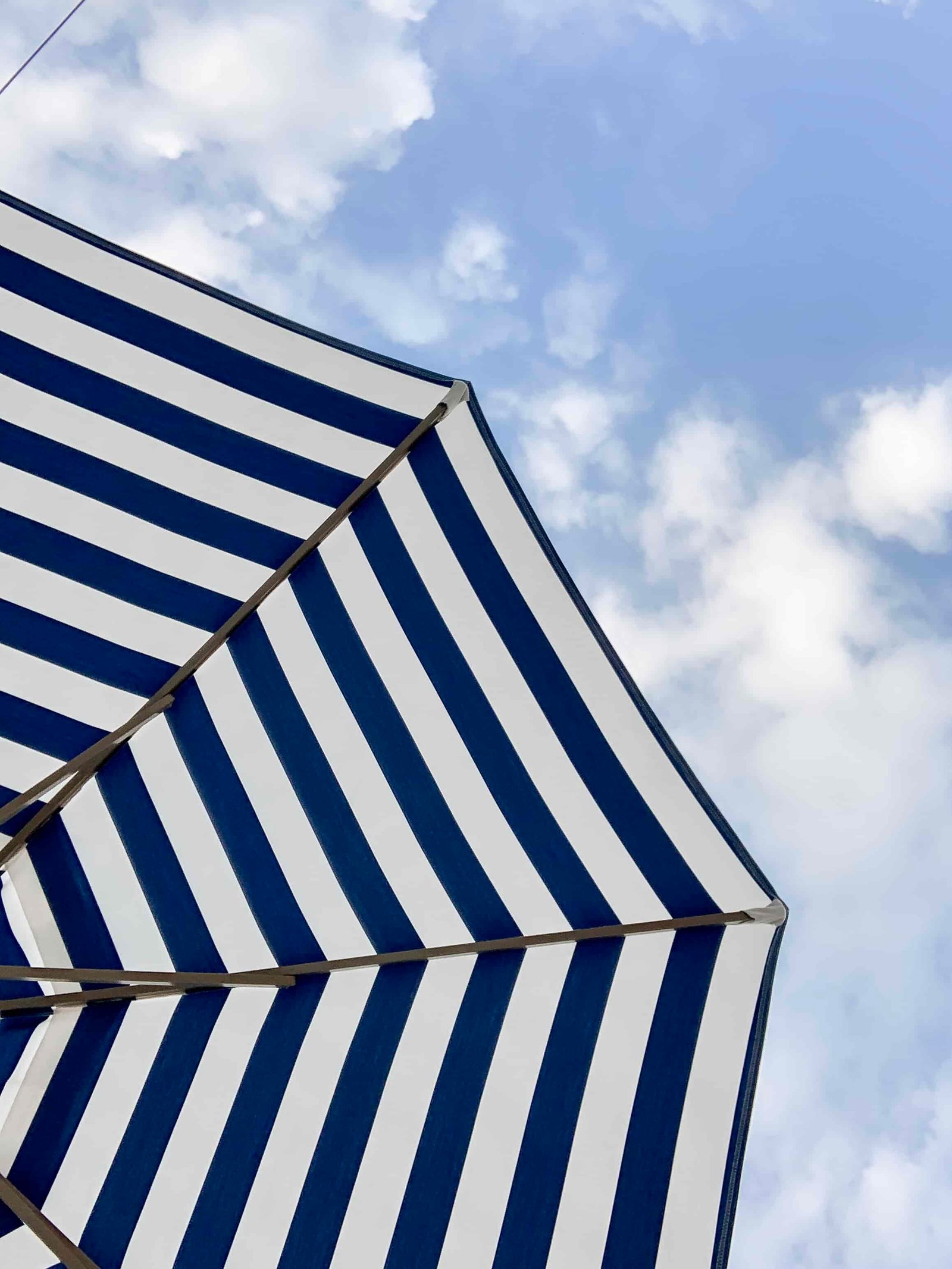 striped blue and white sun umbrella