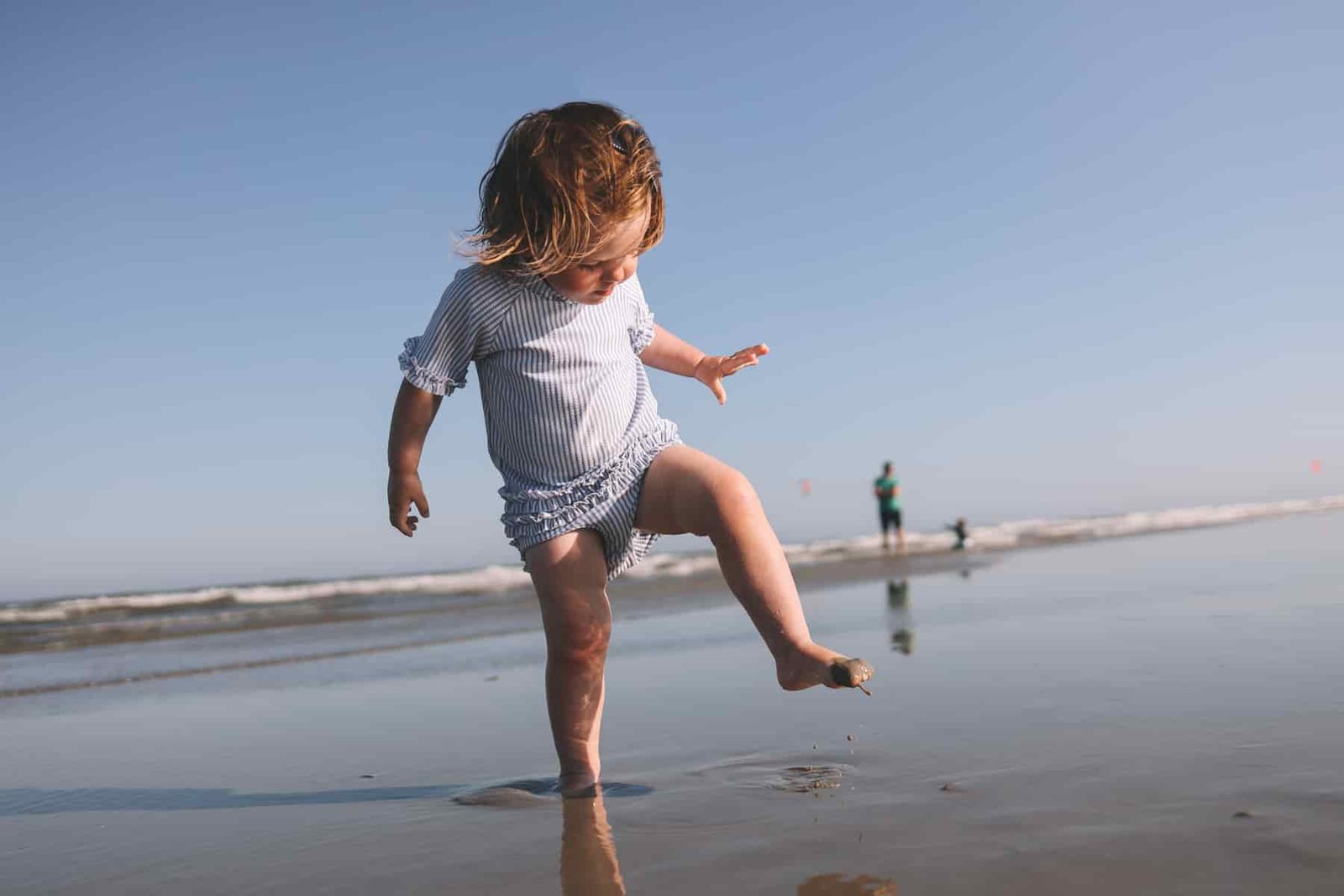 toddler stomping on the sand toddler stomping on the sand